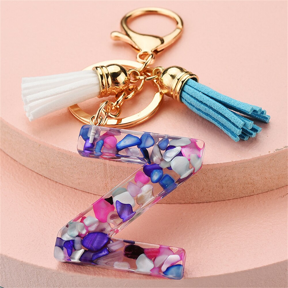 1PC Women Keychains 26 Glitter Hollowed-out Words Handbag Tassel English Letter Keyring with Puffer Ball Charms Free Shipping