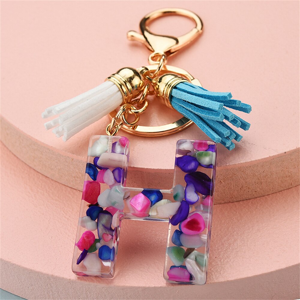 1PC Women Keychains 26 Glitter Hollowed-out Words Handbag Tassel English Letter Keyring with Puffer Ball Charms Free Shipping