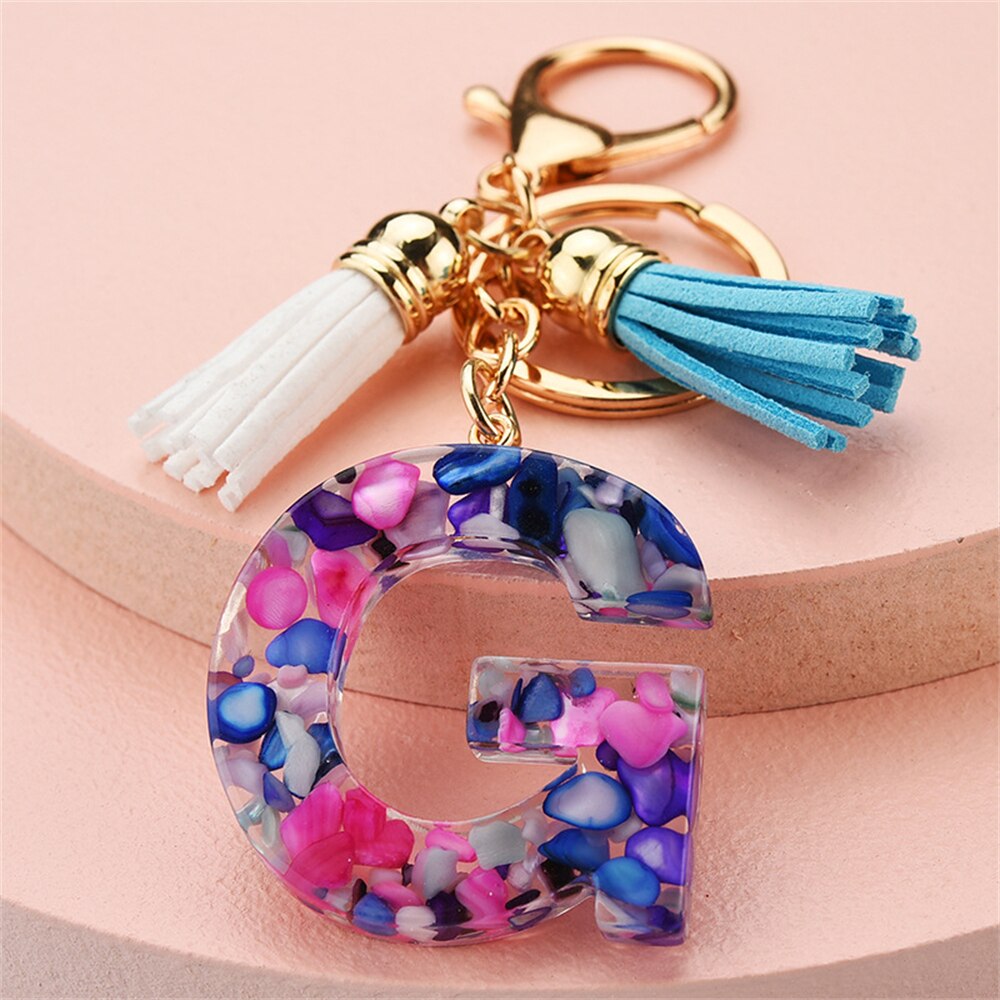 1PC Women Keychains 26 Glitter Hollowed-out Words Handbag Tassel English Letter Keyring with Puffer Ball Charms Free Shipping