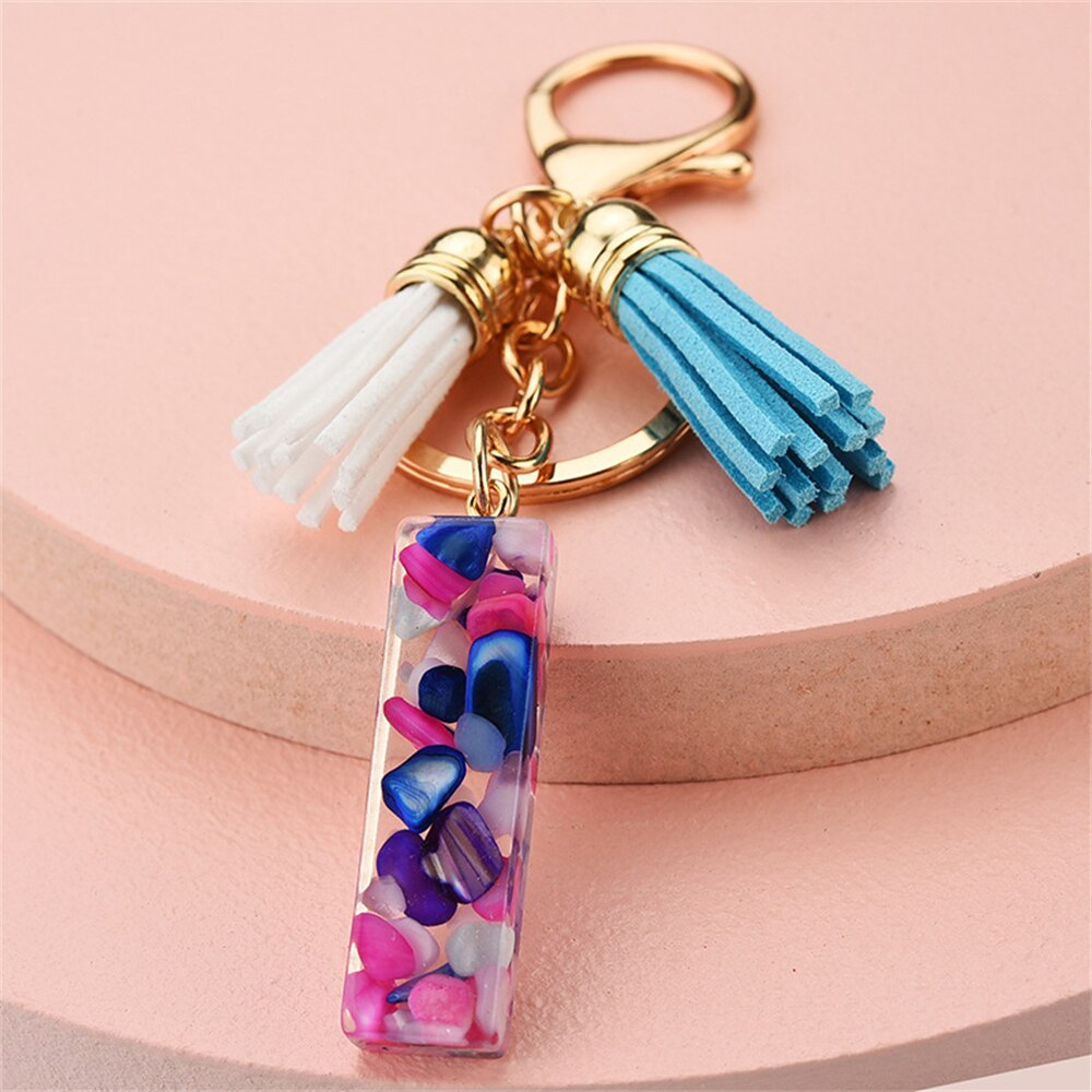 1PC Women Keychains 26 Glitter Hollowed-out Words Handbag Tassel English Letter Keyring with Puffer Ball Charms Free Shipping