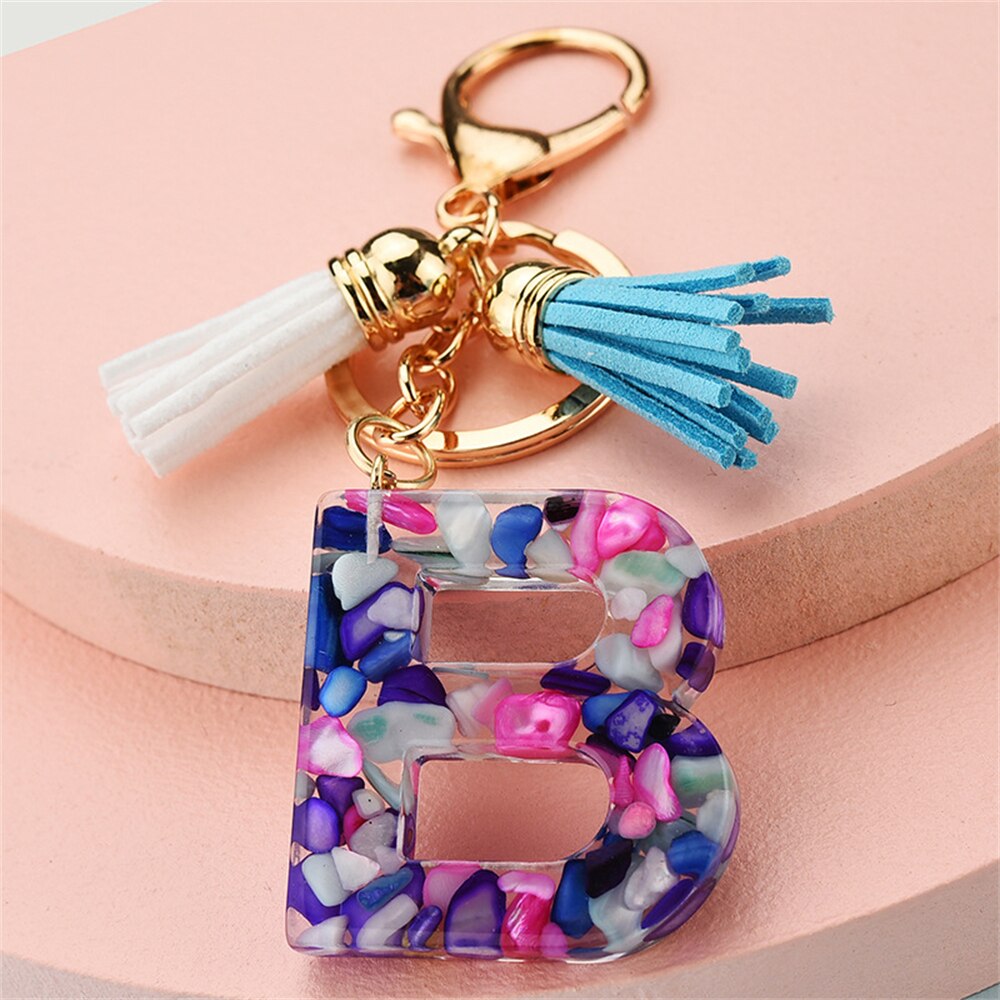 1PC Women Keychains 26 Glitter Hollowed-out Words Handbag Tassel English Letter Keyring with Puffer Ball Charms Free Shipping